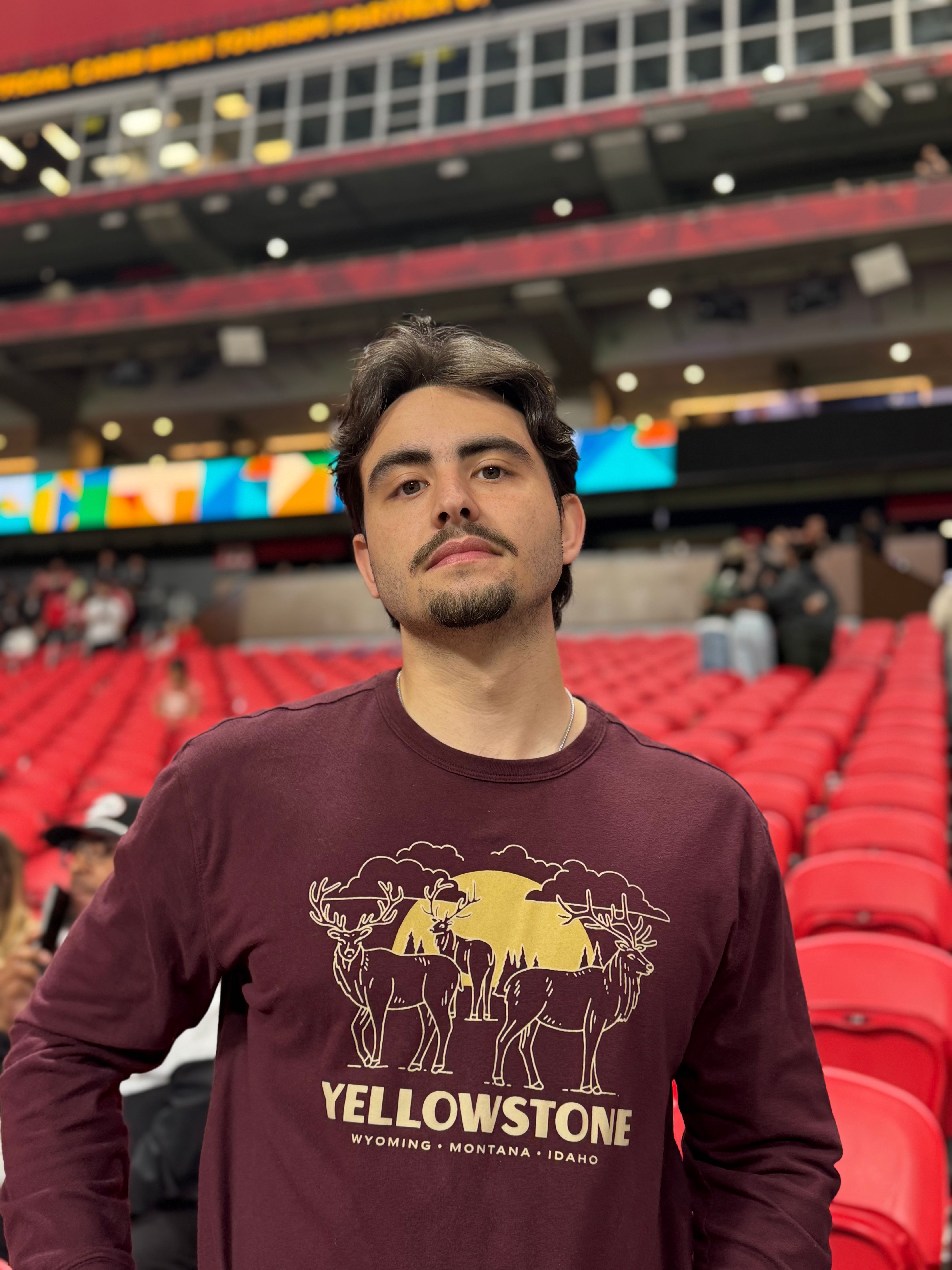 Daniel in a Yellowstone t-shirt at a stadium